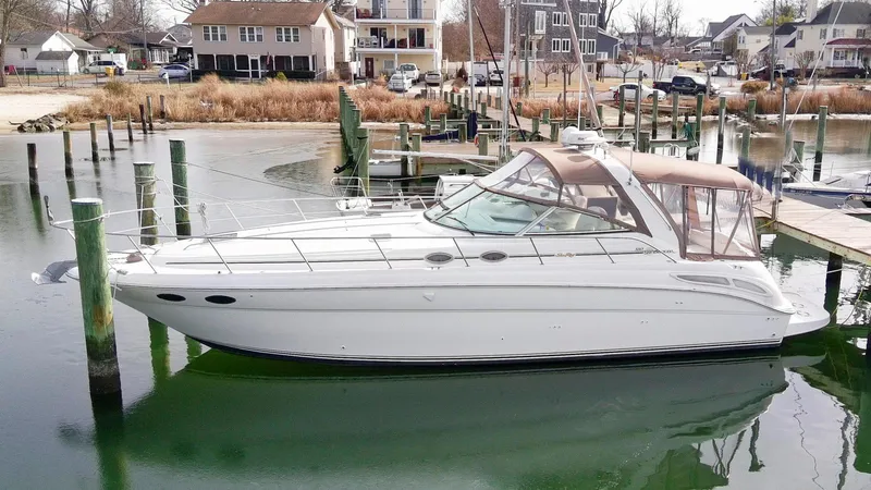 The Image of 1999 Sea Ray 380 Sundancer yacht docked in a marina. - 0