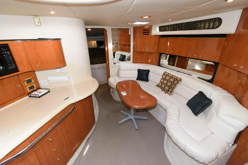 Slide: The Image of Luxurious interior of 1999 Sea Ray 380 Sundancer yacht with plush seating and elegant wood finishes. - 13