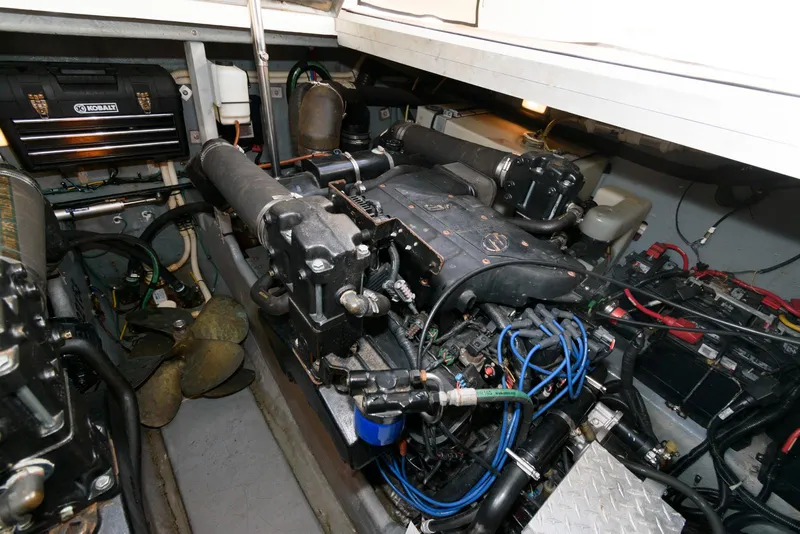 Slide: The Image of Engine room of 1999 Sea Ray 380 Sundancer with visible mechanical components. - 22