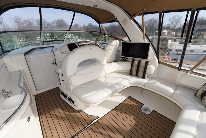 Slide: The Image of Luxurious interior of 1999 Sea Ray 380 Sundancer yacht with plush seating and modern amenities. - 6