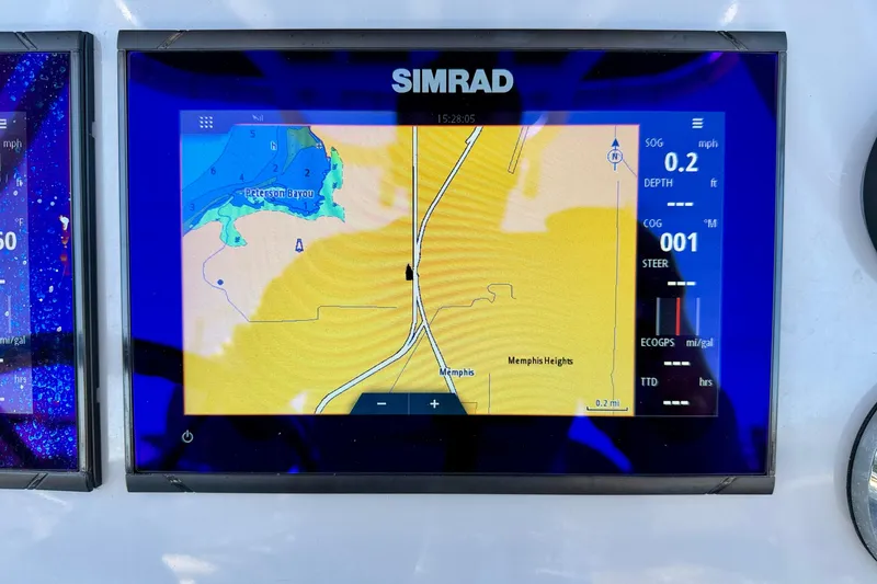 Slide: The Image of Simrad navigation display on 2023 Bayliner Trophy T24CC boat, showing map and data. - 14