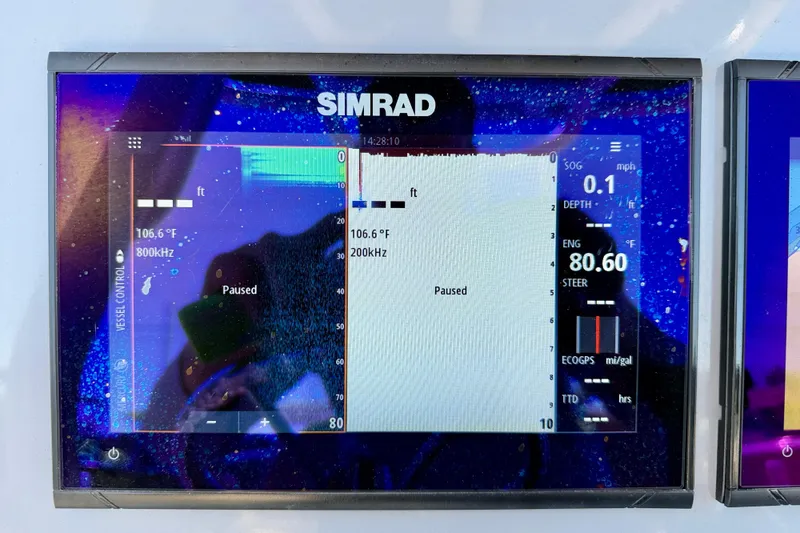 Slide: The Image of Simrad marine display on 2023 Bayliner Trophy T24CC showing sonar and navigation data. - 15