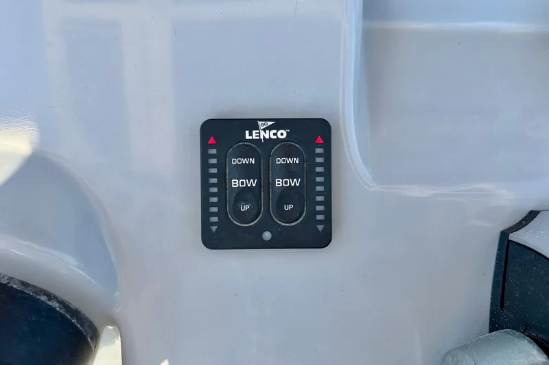 Slide: The Image of Lenco trim tab control on 2023 Bayliner Trophy T24CC boat dashboard. - 17