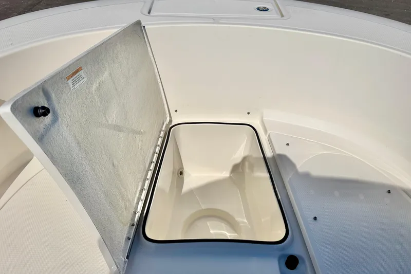 Slide: The Image of Open storage compartment on 2023 Bayliner Trophy T24CC boat deck. - 34