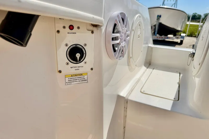 Slide: The Image of 2023 Bayliner Trophy T24CC boat battery switch and speaker detail. - 35