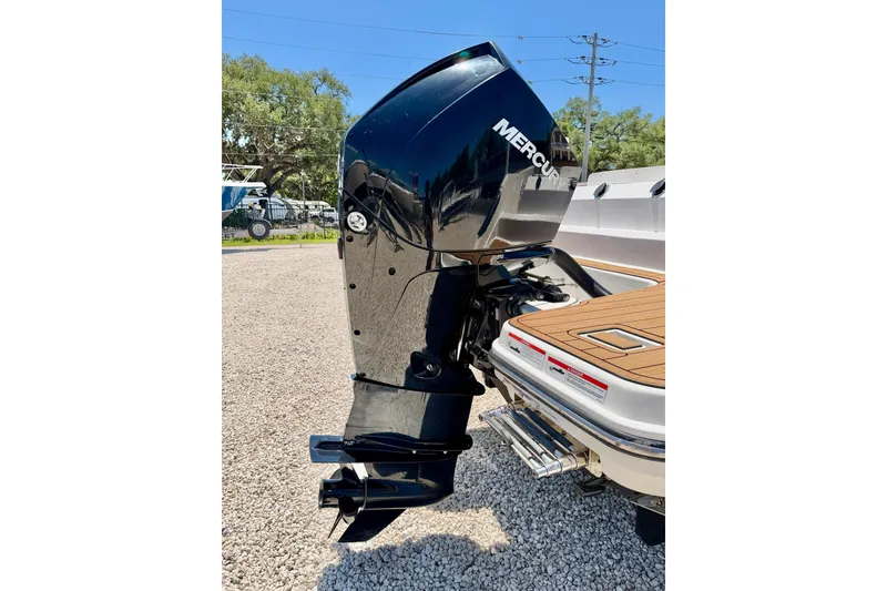 Slide: The Image of 2023 Bayliner Trophy T24CC with Mercury outboard engine, displayed on gravel surface. - 39