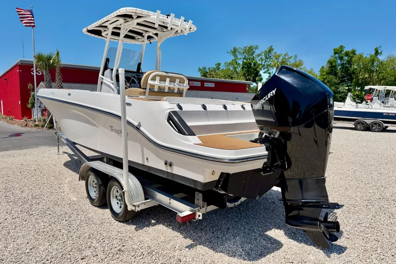 Slide: The Image of 2023 Bayliner Trophy T24CC boat on trailer with Mercury outboard motor. - 7