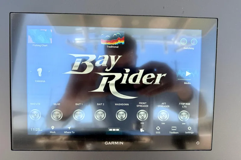 Slide: The Image of Garmin display on 2026 Bay Rider 239 Bay boat showing navigation and control options. - 17