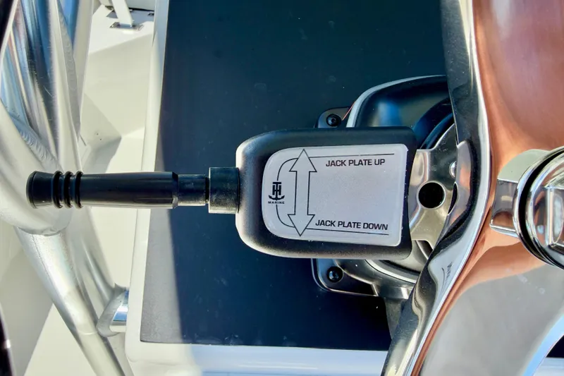 Slide: The Image of Close-up of a 2026 Bay Rider 239 Bay boat jack plate control lever. - 21