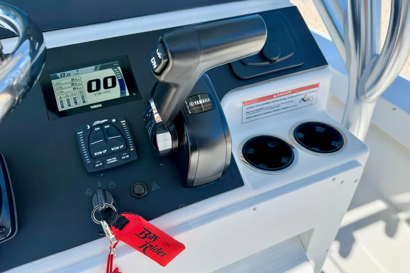 Slide: The Image of Control panel of 2026 Bay Rider 239 Bay boat with Yamaha throttle and digital display. - 22