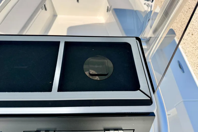 Slide: The Image of 2026 Bay Rider 239 Bay boat console with wireless charging pad. - 24