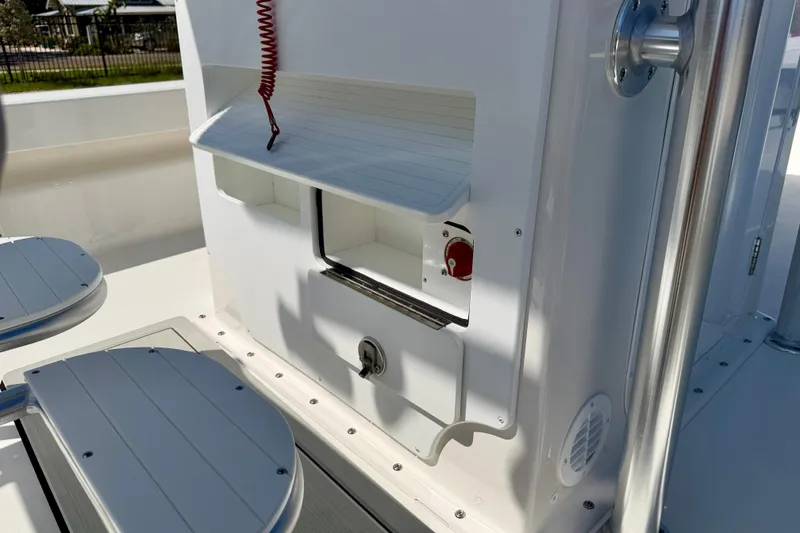 Slide: The Image of Interior view of 2026 Bay Rider 239 Bay boat, featuring seating and storage compartments. - 25