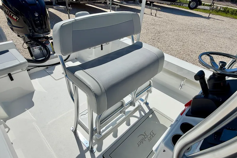 Slide: The Image of 2026 Bay Rider 239 Bay boat interior with seating and steering console. - 27