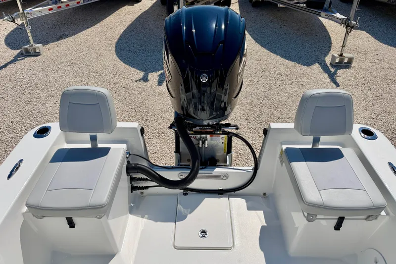 Slide: The Image of 2026 Bay Rider 239 Bay boat interior with dual seats and powerful outboard motor. - 30