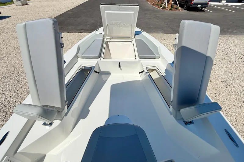 Slide: The Image of 2026 Bay Rider 239 Bay boat interior with open storage compartments and seating. - 35
