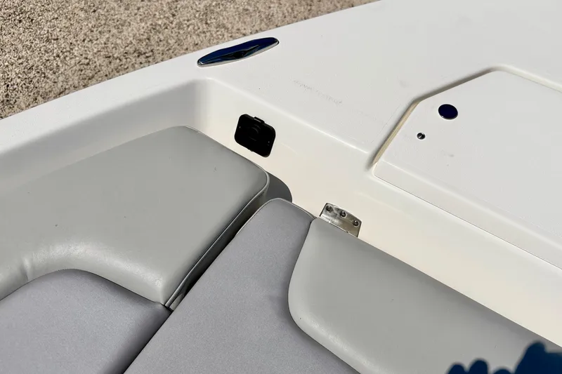 Slide: The Image of 2026 Bay Rider 239 Bay boat interior with gray seating and storage compartment. - 39