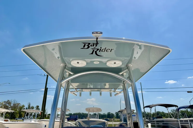 Slide: The Image of Bay Rider 239 Bay 2026 boat with T-top under clear blue sky. - 40