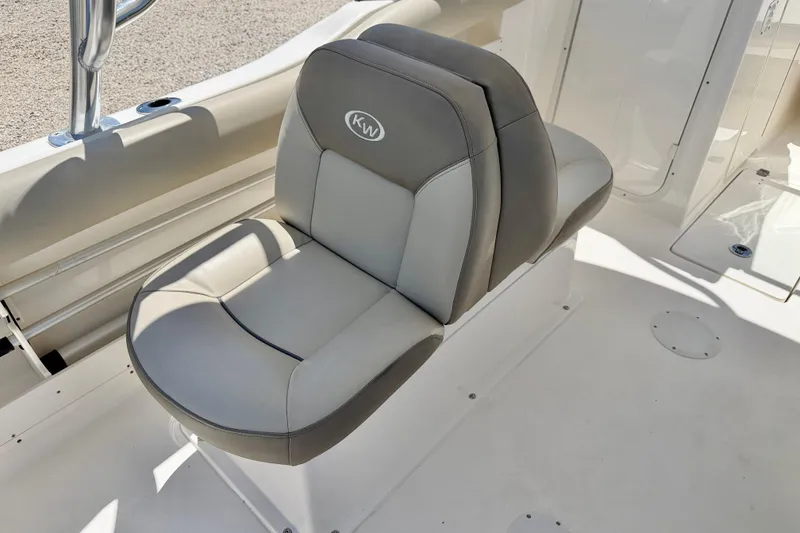 Slide: The Image of 2024 Key West 239 DFS boat seat, featuring gray and white cushioned design. - 21