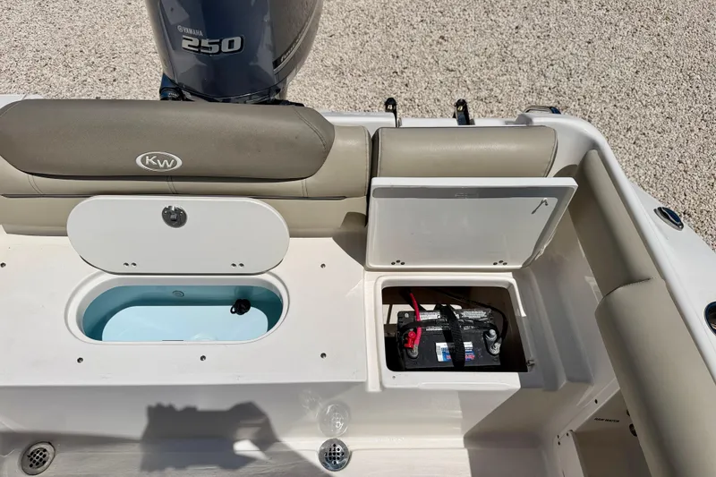 Slide: The Image of 2024 Key West 239 DFS boat with Yamaha 250 engine and battery compartment. - 26