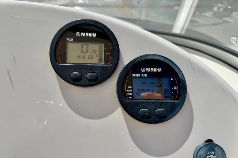 Slide: The Image of Yamaha gauges on 2024 Key West 239 DFS boat dashboard, displaying tachometer and speed fuel data. - 28