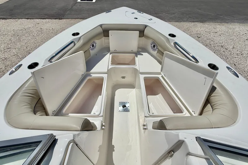 Slide: The Image of 2024 Key West 239 DFS boat interior with open storage compartments and cushioned seating. - 31