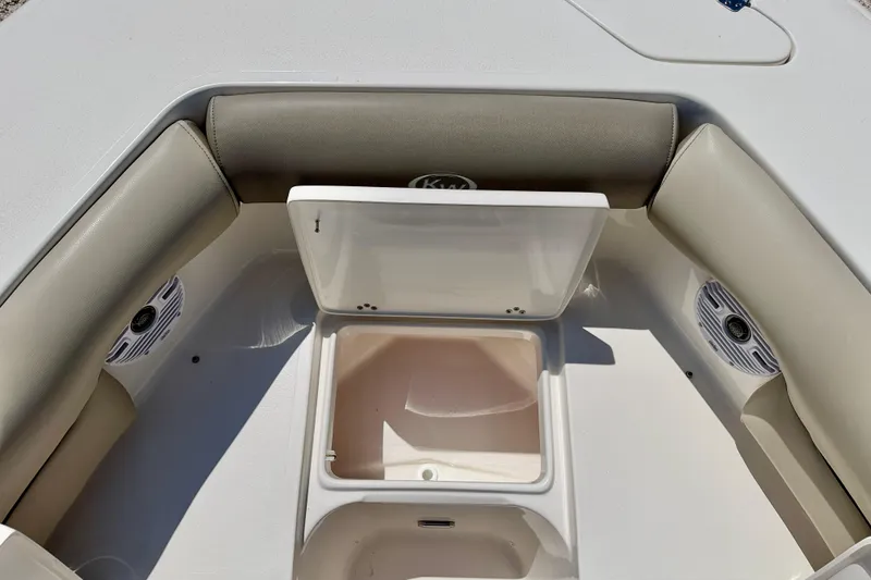 Slide: The Image of 2024 Key West 239 DFS boat interior with storage compartment and speakers. - 32