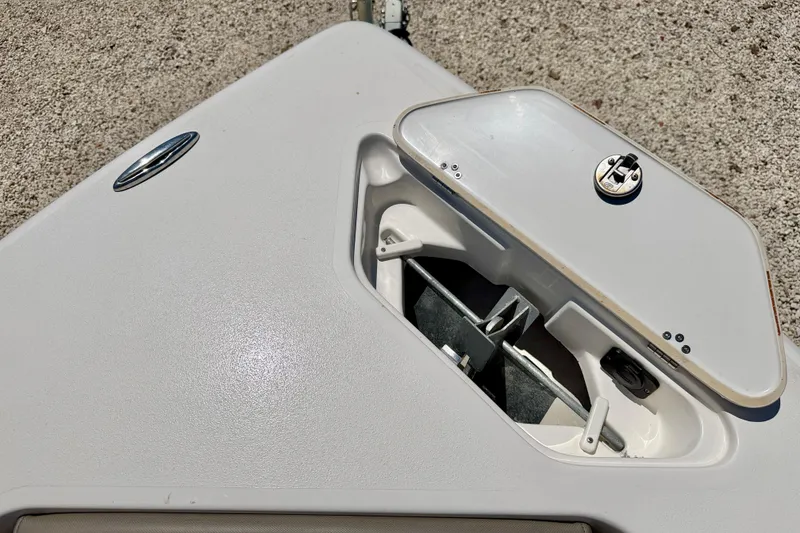 Slide: The Image of 2024 Key West 239 DFS boat anchor compartment with open hatch on deck. - 33