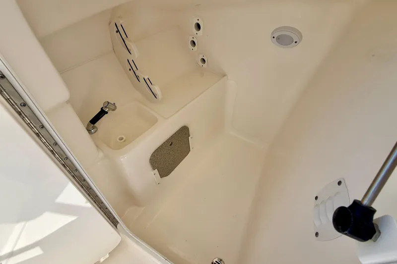 Slide: The Image of Interior view of 2024 Key West 239 DFS boat, featuring a compact sink and storage area. - 37