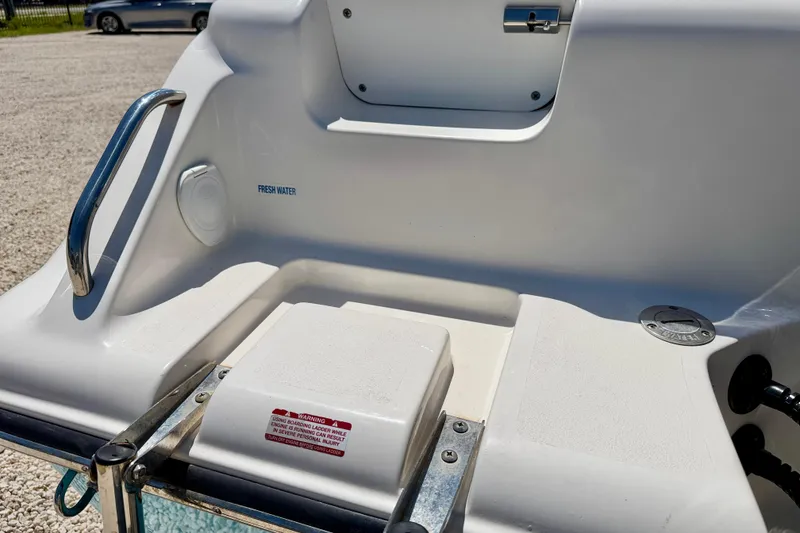 Slide: The Image of 2024 Key West 239 DFS boat stern with fresh water access and boarding ladder. - 38
