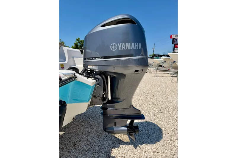 Slide: The Image of 2024 Key West 239 DFS boat with Yamaha four-stroke outboard motor, displayed outdoors. - 41