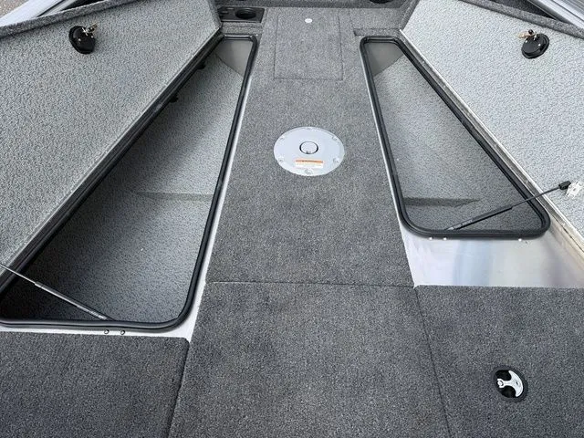 Slide: The Image of Interior of 2026 Lund 2075 Impact XS Sport with storage compartments. - 12
