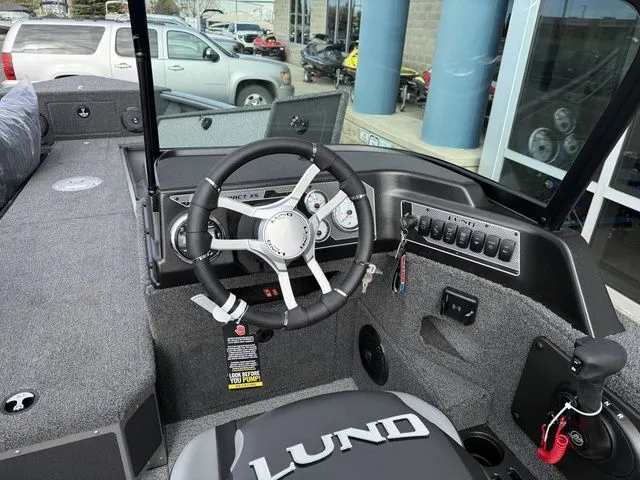 Slide: The Image of Interior view of the 2026 Lund 2075 Impact XS Sport boat. - 16