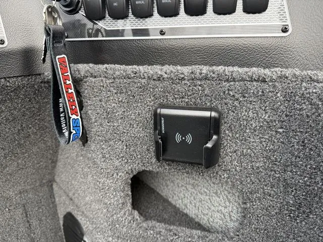 Slide: The Image of Interior of 2026 Lund 2075 Impact XS Sport with keychain and charger. - 21