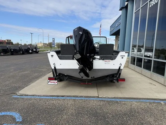 Slide: The Image of Rear view of 2026 Lund 2075 Impact XS Sport boat. - 6