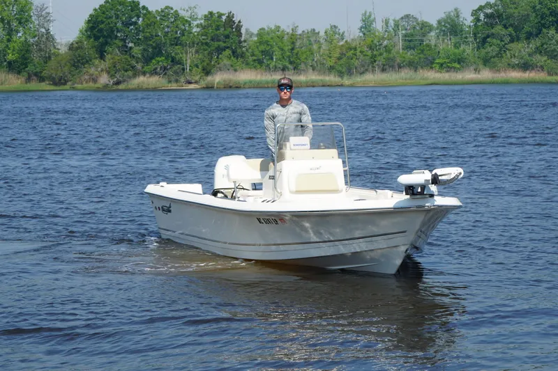 Slide: The Image of 2020 Bulls Bay 2000 boat on a lake with a person steering. - 4