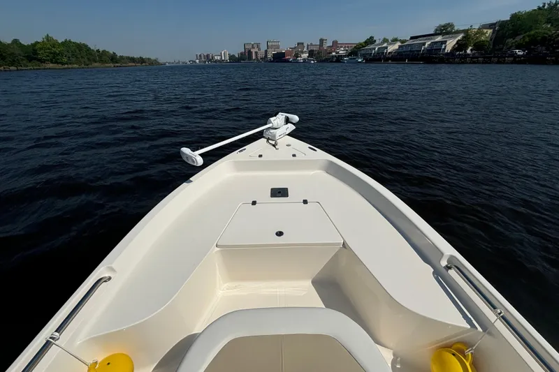 Slide: The Image of 2020 Bulls Bay 2000 boat on a calm river with city skyline. - 6