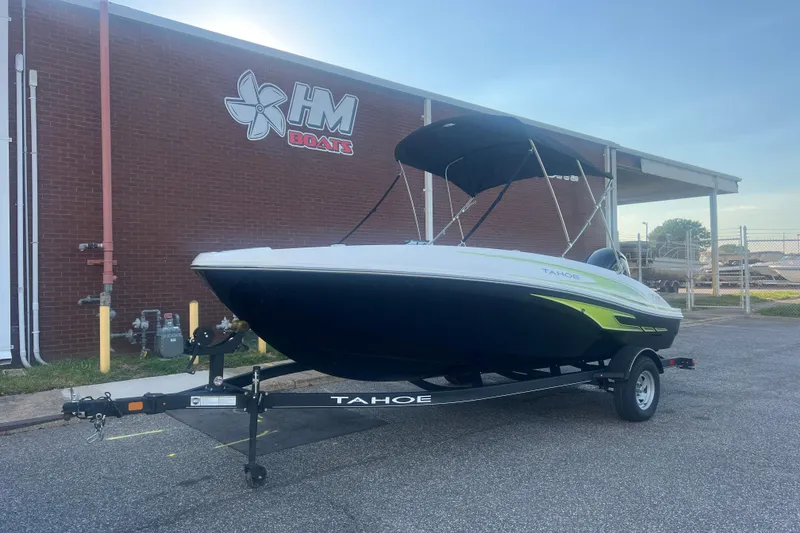 Slide: The Image of 2023 Tahoe T18 boat on trailer outside HM Boats building. - 10