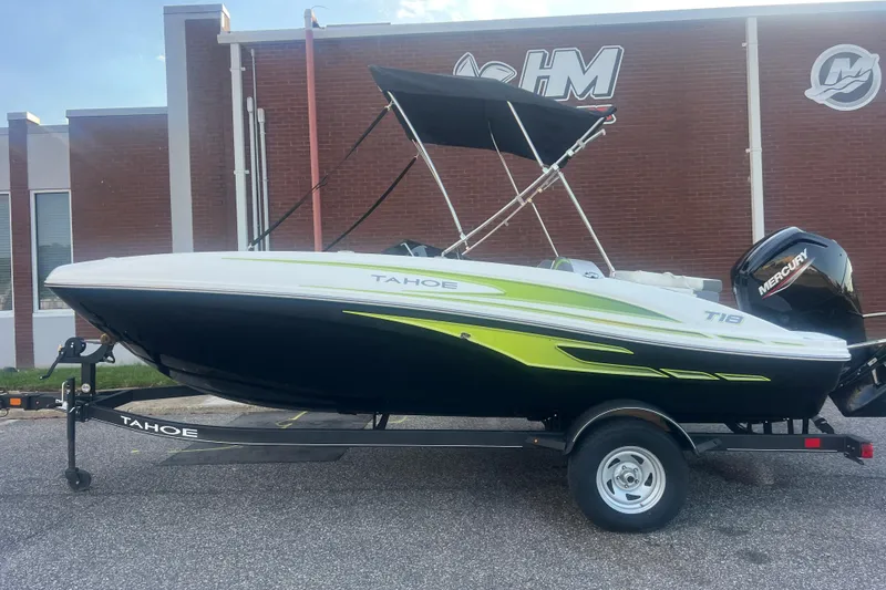 Slide: The Image of 2023 Tahoe T18 boat with trailer, featuring sleek design and vibrant accents. - 11