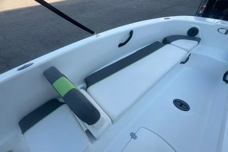 Slide: The Image of 2023 Tahoe T18 boat interior with cushioned seating and sleek design. - 26