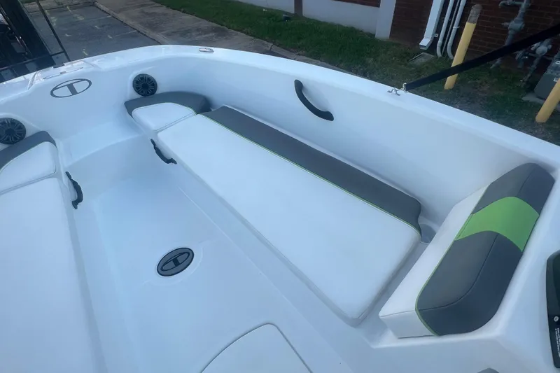 Slide: The Image of 2023 Tahoe T18 boat interior with cushioned seating and modern design. - 27