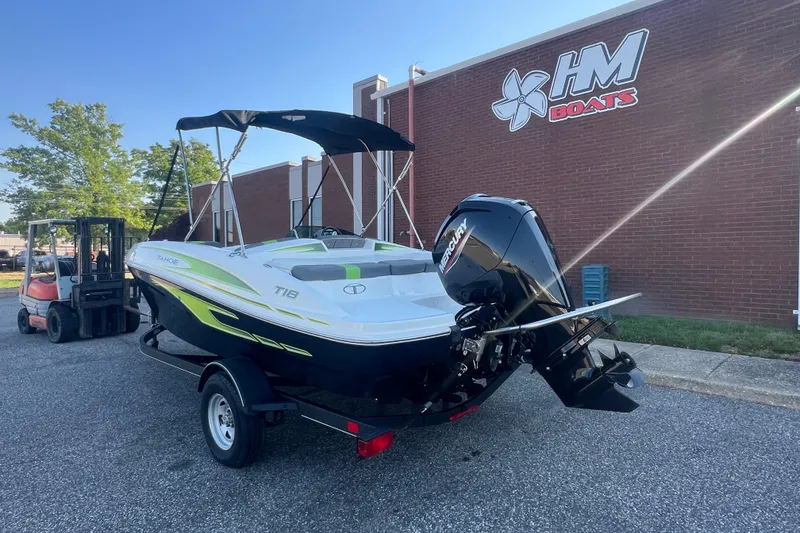 Slide: The Image of 2023 Tahoe T18 boat with Mercury engine on trailer outside HM Boats building. - 3