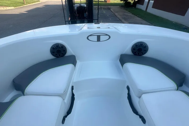 Slide: The Image of 2023 Tahoe T18 boat interior with cushioned seating and speakers. - 30