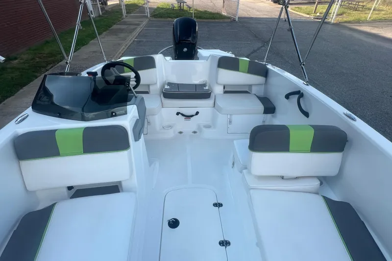 Slide: The Image of 2023 Tahoe T18 boat interior with modern seating and steering console. - 32