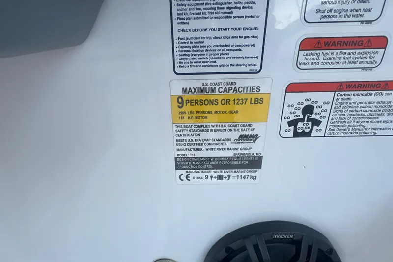 Slide: The Image of 2023 Tahoe T18 capacity label: 9 persons or 1237 lbs, safety warnings included. - 35