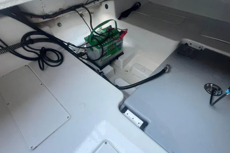 Slide: The Image of 2023 Tahoe T18 boat interior showing battery compartment and wiring setup. - 39