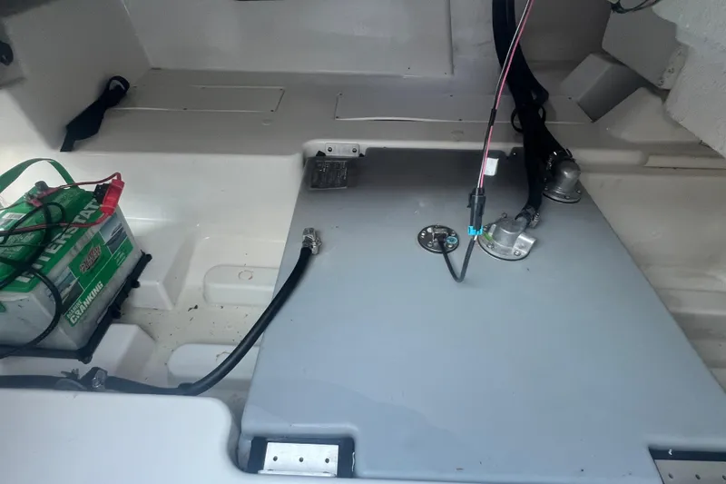Slide: The Image of 2023 Tahoe T18 boat interior showing battery and wiring setup. - 40
