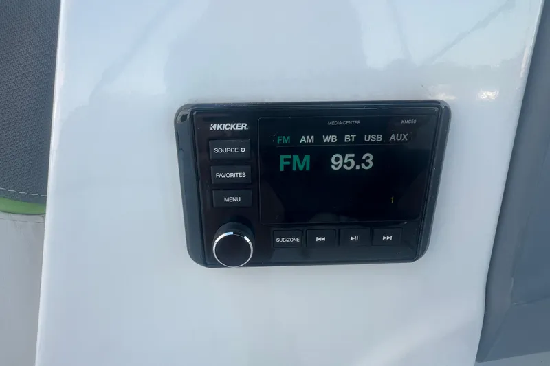 Slide: The Image of Kicker media center in 2023 Tahoe T18 displaying FM 95.3 radio station. - 42