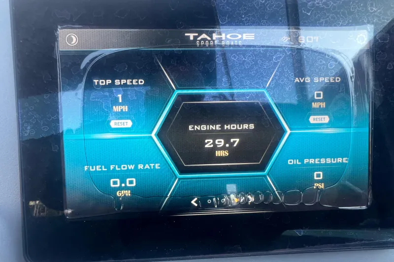 Slide: The Image of Dashboard display of a 2023 Tahoe T18 boat showing engine hours and speed metrics. - 43