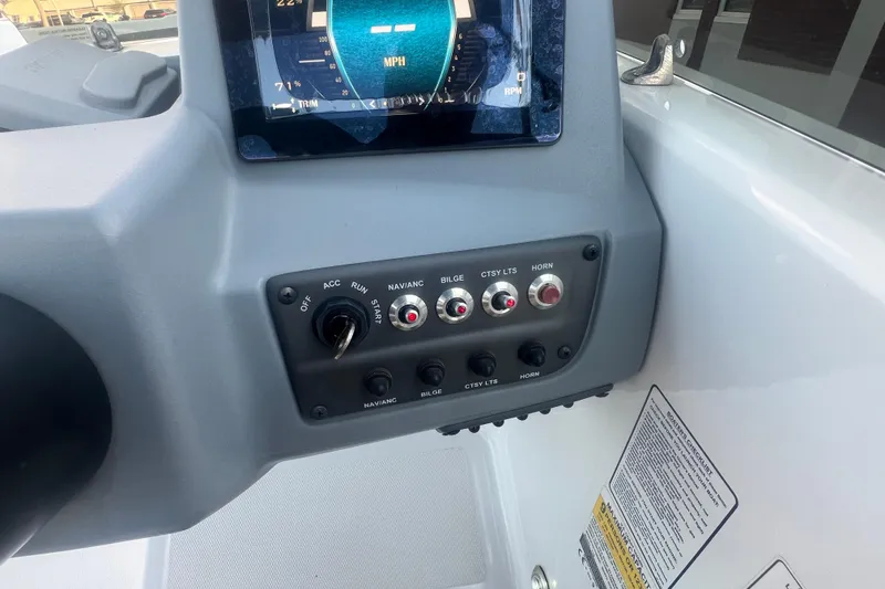 Slide: The Image of 2023 Tahoe T18 boat dashboard with control panel and digital display. - 45