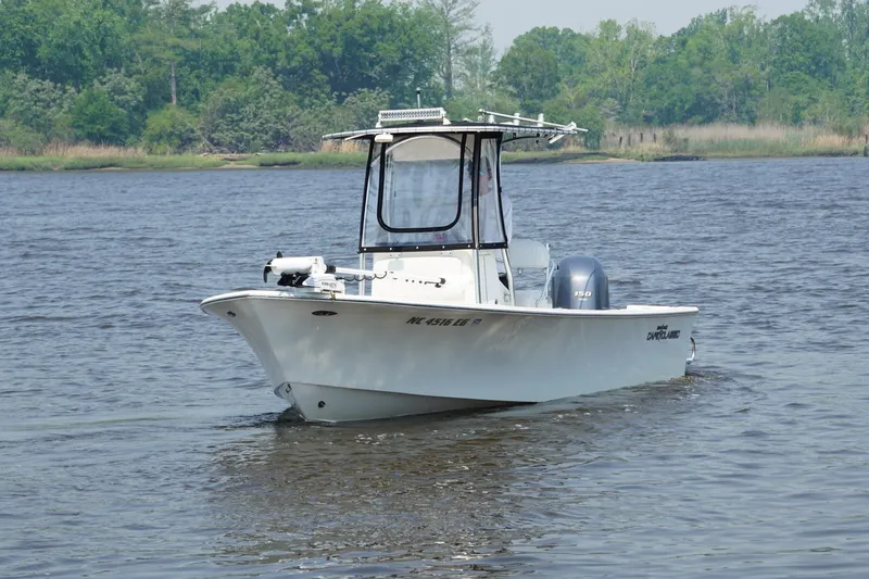 Slide: The Image of 2018 May-Craft 20 Cape Classic boat cruising on a serene lake. - 5